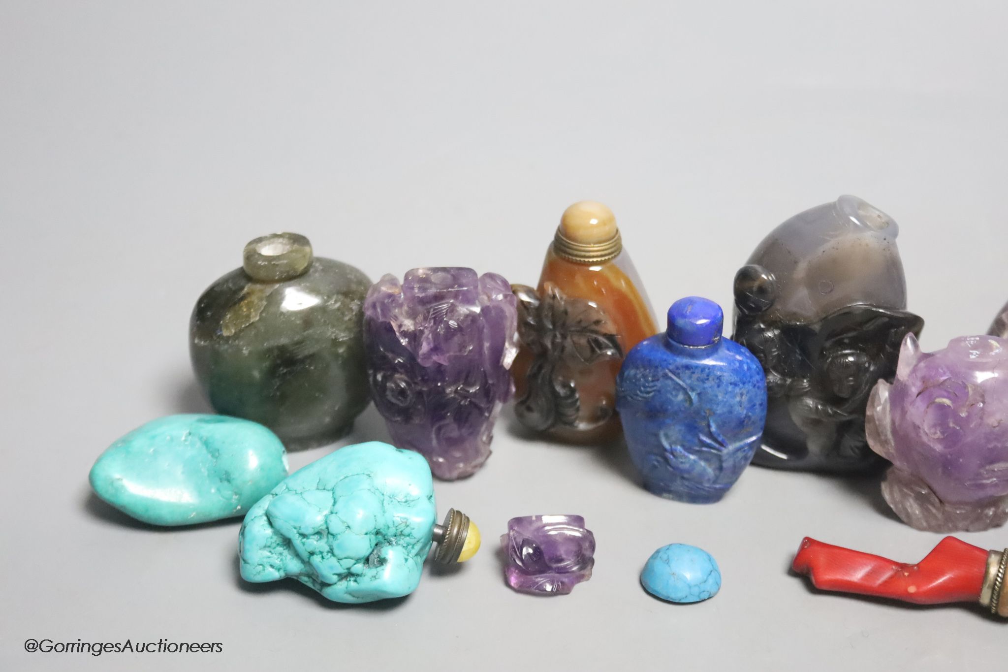 A collection of ten Chinese amethyst, lapis lazuli, turquoise and other hardstone snuff bottles